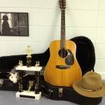 Hat, guitar, possum, trophy. In the green room at the Ozark Folk Center.